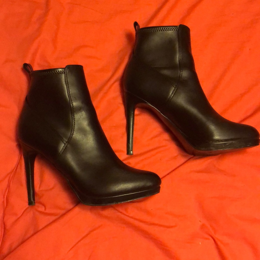 Good condition over all, slight heel damage and indention on bottom of one